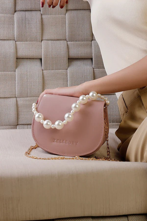 Canvas By Usman pink faux leather mini handbag with pearl handle and gold chain, perfect for formal occasions.